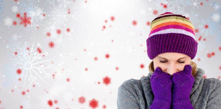 Freeze woman with gloves and a hat against snowflake pattern