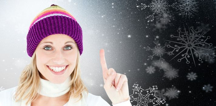 Positive woman showing up smiling at the camera against white background against snowflake pattern