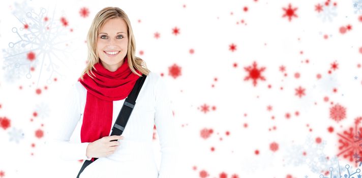 Portrait of a delighted student with scarf smiling at the camera against snowflake pattern