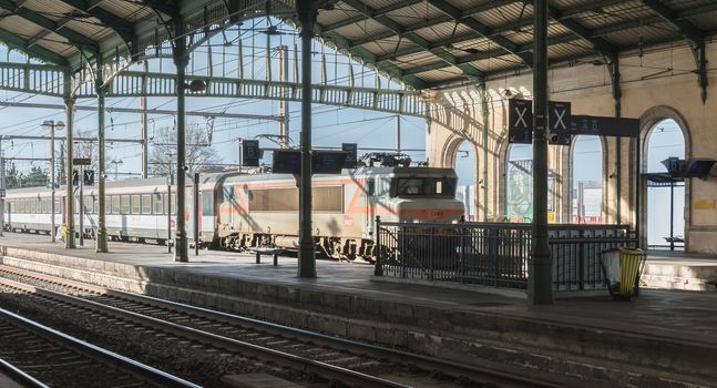 Sete, France - January 4, 2019: train entering in the city train station on a winter day