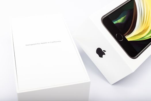 Paris, France - May 14, 2020: packaging of the new black iPhone SE 2020 from the multinational company Apple during the days of its studio release on a white background