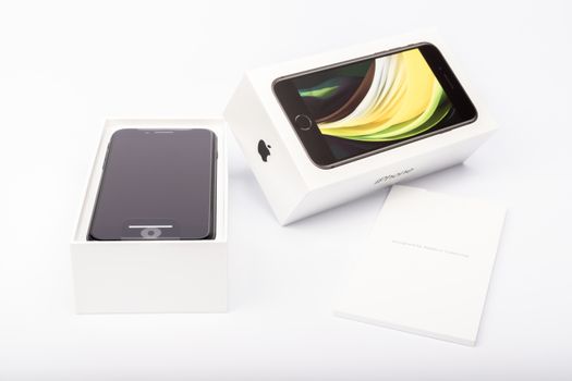 Paris, France - May 14, 2020: packaging of the new black iPhone SE 2020 from the multinational company Apple during the days of its studio release on a white background