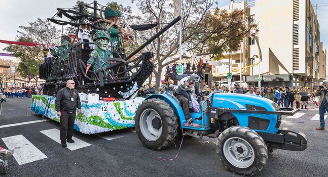 Loule, Portugal - February 25, 2020: Float parading in the street in front of the public in the parade of the traditional carnival of Loule city on a February day