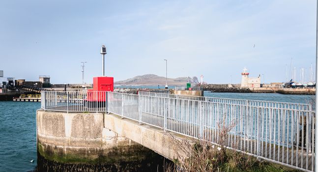 Howth near Dublin, Ireland - February 15, 2019: Illuminated signal for boat guidance at the entrance to Howth harbor on a winter day