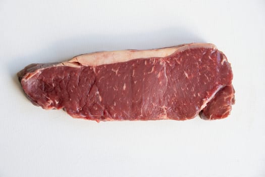 Raw Sirlion steak isolated on a white background