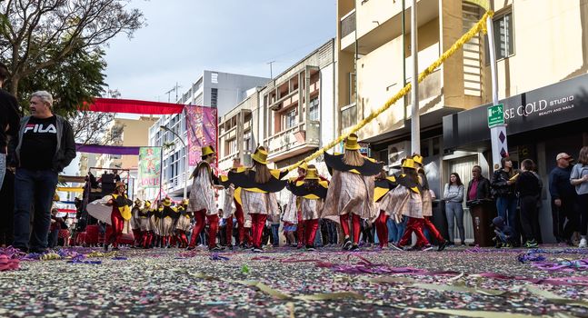 Loule, Portugal - February 25, 2020: dancers parading in the street in front of the public in the parade of the traditional carnival of Loule city on a February day