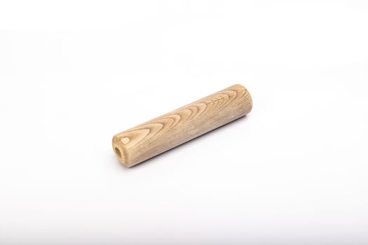 wooden rolling pin on white background in studio