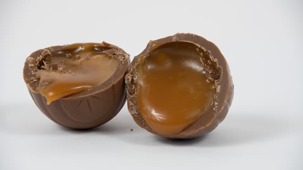 Cut open chocolate egg with a caramel centre