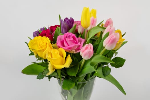 Bunch of Roses and Tulip flowers isolated on a white background