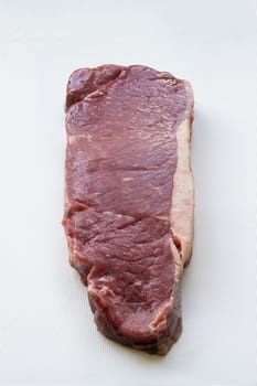 Raw Sirlion steak isolated on a white background