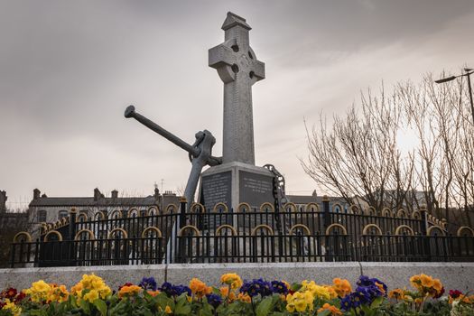 Howth near Dublin, Ireland - February 15, 2019: view of the monument was erected by the Howth fishermans association and commemorates the lives of all persons lost at sea in the city center on a winter day