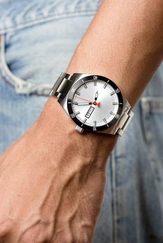 closeup luxury watch on man's wrist