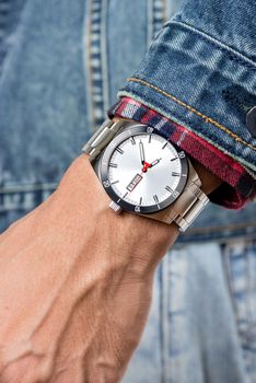 closeup luxury watch on man's wrist