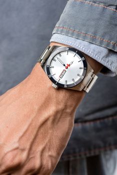 closeup luxury watch on man's wrist