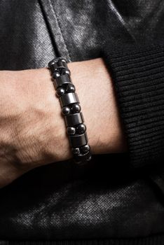 closeup leather bracelet on man's wrist