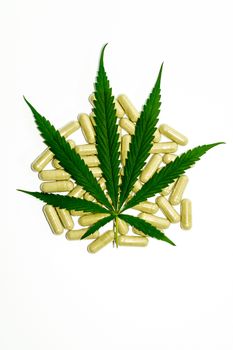 Thai marijuana pills on a white background