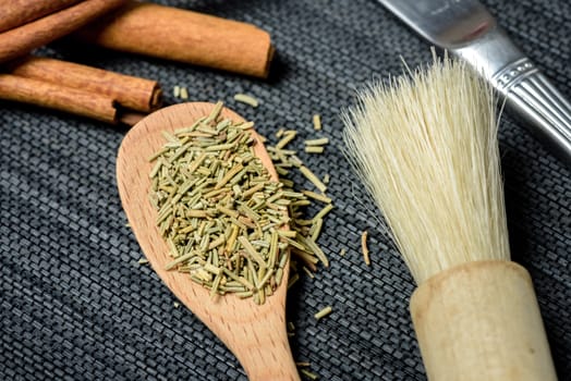 closeup dried rosemary in the kitchen. herbs for cooking.