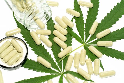 Thai marijuana pills on a white background