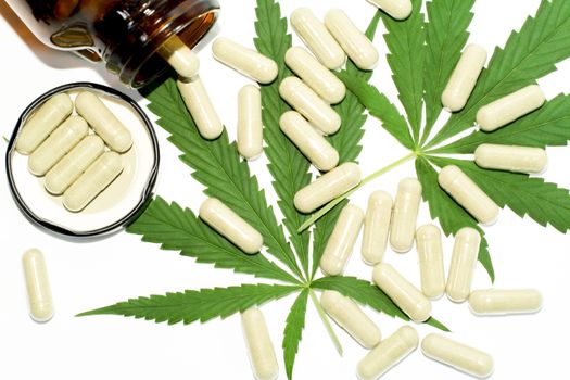 Thai marijuana pills on a white background