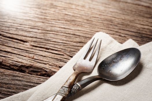 dinning table with old brass spoon and fork