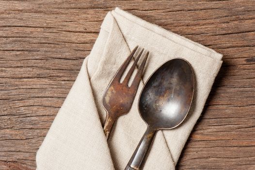 dinning table with old brass spoon and fork