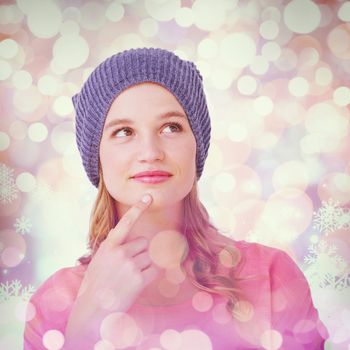 Thoughtful hipster woman with hat  against snowflake pattern