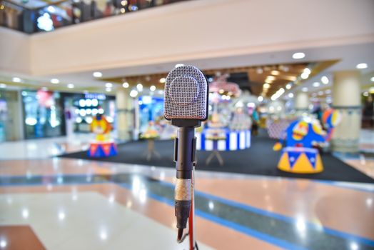 Microphone on abstract blurred of The space in the meeting and stage performances