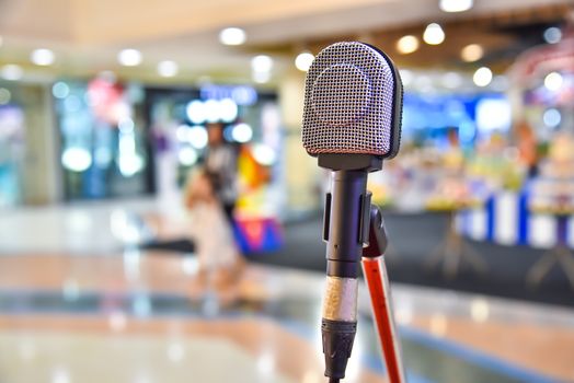 Microphone on abstract blurred of The space in the meeting and stage performances