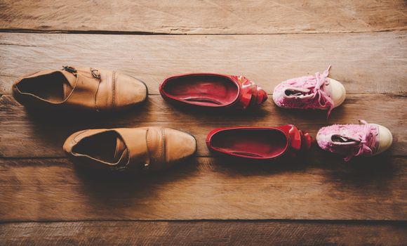 shoes, three pairs of dad, mom, daughter - the family concept 