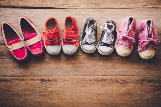 shoes for children on wooden floor