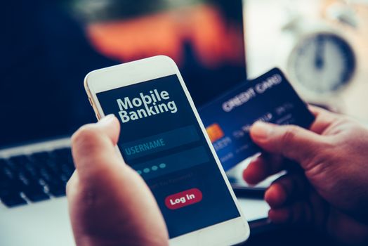 hands using mobile banking on smart phone 