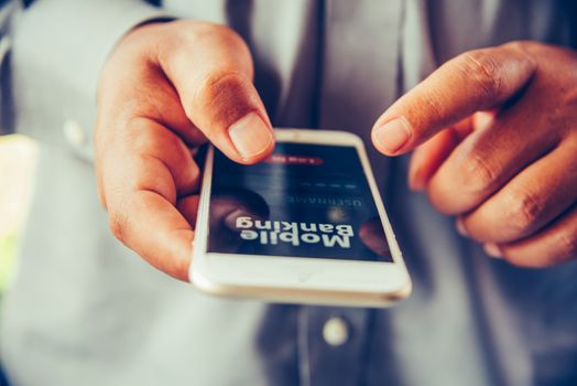 hands using mobile banking on smart phone 