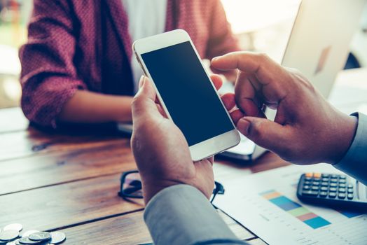 hands business holding blank screen mobile in desk work.