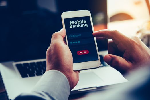 hands using mobile banking on smart phone 