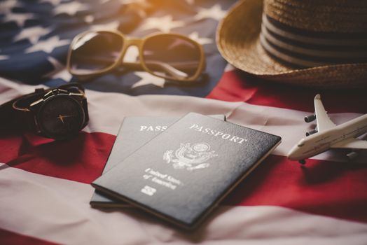 Passport is placed on the US flag. Preparing for a legitimate journey