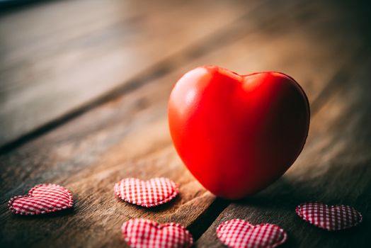 The heart lay on the wooden floor - Valentine Day concept.