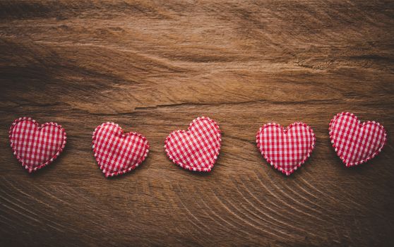 The heart lay on the wooden floor - Valentine Day concept.