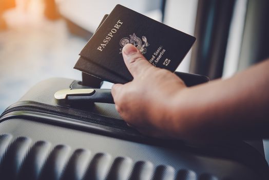 People holding passports, map for travel with luggage for the trip 
