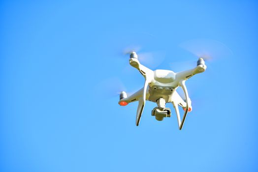 drone quad copter with  digital camera on the sky 