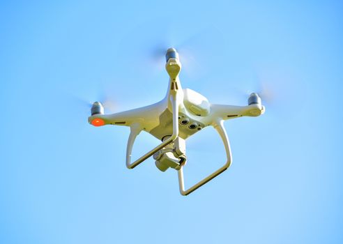 drone quad copter with  digital camera on the sky 