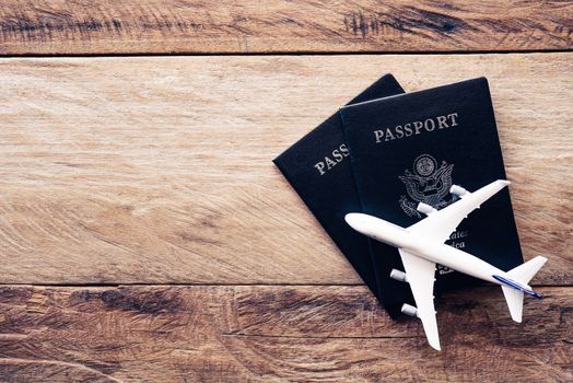 top view  passport  on wooden table, for travel concept