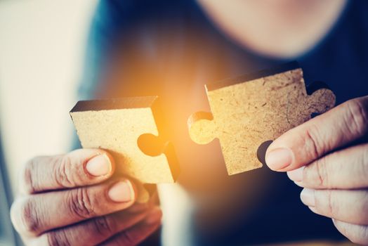 Business people are taking puzzles to connect. Ideas about building a business network.