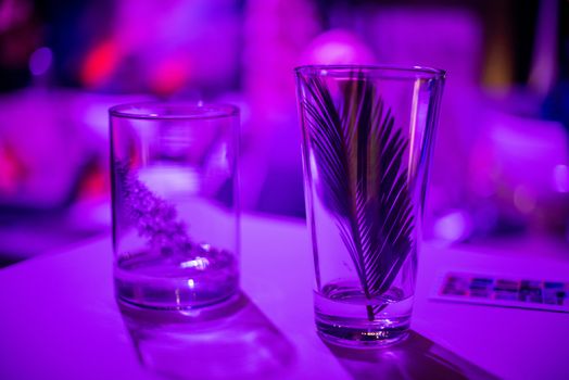 Empty glasses on table in night club