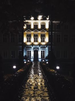 Exterior facade of classic building in the European city at night, architecture and design detail