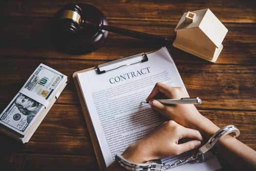 The hand was handcuffed by writing a contract, the concept was forced to be unfair in the contract.