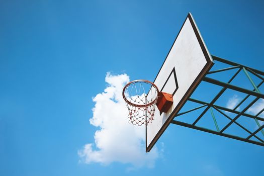 basketball ring against blue sky background