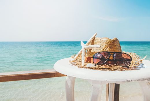 beach items on the table with bright beach background