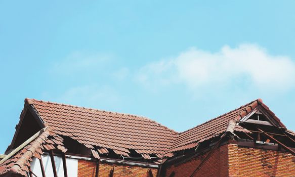 old broken roof and sky background