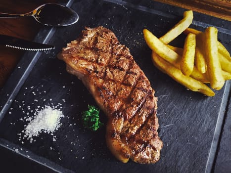 grilled beef steak on cutting board