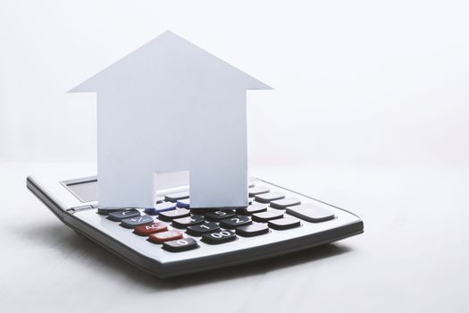 house symbol with calculator on white background